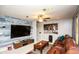 Cozy living room with modern wall decor, a large TV, and comfortable leather seating at 190 Country Club Dr, Hiram, GA 30141