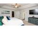 Spacious main bedroom featuring a closet, a blue dresser, and abundant natural light at 190 Country Club Dr, Hiram, GA 30141