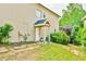 Green backyard featuring a covered entrance and patio at 3435 Vista Creek Dr, Dacula, GA 30019