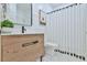 Modern bathroom with a stylish vanity, mirror, and patterned shower curtain at 3435 Vista Creek Dr, Dacula, GA 30019