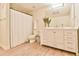 Well-lit bathroom with white vanity, large mirror, and shower with white curtain at 3435 Vista Creek Dr, Dacula, GA 30019