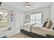 Cozy bedroom featuring plush carpeting, a comfortable bed, and a window view at 3435 Vista Creek Dr, Dacula, GA 30019