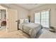 Serene bedroom with ample natural light, neutral decor, and comfortable furnishings at 3435 Vista Creek Dr, Dacula, GA 30019