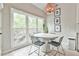 Charming breakfast nook with large windows, a round table, and stylish chairs at 3435 Vista Creek Dr, Dacula, GA 30019