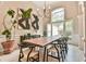 Bright dining room with large window, contemporary decor, and a spacious wooden table at 3435 Vista Creek Dr, Dacula, GA 30019