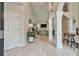 Open-concept foyer with hardwood floors, high ceilings, and modern lighting fixtures at 3435 Vista Creek Dr, Dacula, GA 30019