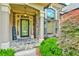Inviting front porch with stone accents, stylish door, and welcoming decor at 3435 Vista Creek Dr, Dacula, GA 30019