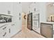 Gourmet kitchen with stainless steel appliances, white cabinets, and modern fixtures at 3435 Vista Creek Dr, Dacula, GA 30019