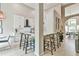 Bright kitchen with white cabinets, a large island with seating, and stainless steel appliances at 3435 Vista Creek Dr, Dacula, GA 30019