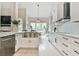 Spacious kitchen with white cabinets, stainless steel appliances, and a large island with seating at 3435 Vista Creek Dr, Dacula, GA 30019