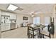Open-concept living area with dining table, sofa, and modern decor at 3435 Vista Creek Dr, Dacula, GA 30019