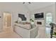 Cozy living room featuring a fireplace, plush sofa, and ample natural light at 3435 Vista Creek Dr, Dacula, GA 30019