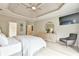 Comfortable main bedroom featuring recessed lights, stylish furniture, and tray ceilings at 3435 Vista Creek Dr, Dacula, GA 30019