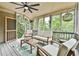 Relaxing screened porch with comfortable seating and views of lush greenery at 3435 Vista Creek Dr, Dacula, GA 30019