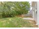 Green backyard featuring a lush lawn, privacy fence, and concrete patio at 1720 New Orleans Way, Mcdonough, GA 30252
