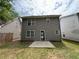 A spacious backyard with a concrete patio and lush green lawn, enclosed by wood fencing for added privacy at 1720 New Orleans Way, Mcdonough, GA 30252