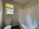 Bathroom with white tub/shower combo at 1720 New Orleans Way, Mcdonough, GA 30252