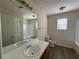 Bathroom featuring a vanity sink, mirror, toilet, and bathtub/shower combo at 1720 New Orleans Way, Mcdonough, GA 30252