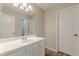 Bathroom vanity with updated fixtures and hardwood floors at 1720 New Orleans Way, Mcdonough, GA 30252