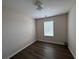 Bedroom featuring hardwood floors and a window at 1720 New Orleans Way, Mcdonough, GA 30252