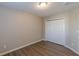 Bedroom features wood-look floors and a closet at 1720 New Orleans Way, Mcdonough, GA 30252