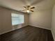 Bedroom featuring hardwood floors and a window at 1720 New Orleans Way, Mcdonough, GA 30252