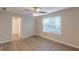 Neutral bedroom featuring natural light, a ceiling fan, and beautiful hardwood floors at 1720 New Orleans Way, Mcdonough, GA 30252