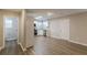 An open view of the Kitchen with stainless steel appliances and a view of the bathroom at 1720 New Orleans Way, Mcdonough, GA 30252