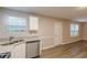 Modern kitchen with stainless steel dishwasher and double basin sink near a bright window at 1720 New Orleans Way, Mcdonough, GA 30252