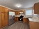 Kitchen featuring stainless steel appliances and wood cabinets at 1720 New Orleans Way, Mcdonough, GA 30252