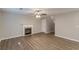 Comfortable living room with fireplace and modern wood flooring at 1720 New Orleans Way, Mcdonough, GA 30252