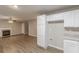 Open concept living area with a fireplace and adjacent kitchen space, perfect for entertaining at 1720 New Orleans Way, Mcdonough, GA 30252