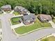 Aerial view of a home on a large corner lot in a quiet suburban neighborhood with mature trees at 2109 Cape Ivey Ct, Dacula, GA 30019