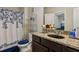 Charming bathroom featuring a granite countertop and blue accents at 2109 Cape Ivey Ct, Dacula, GA 30019