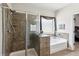 Beautiful bathroom featuring a walk-in shower and soaking tub at 2109 Cape Ivey Ct, Dacula, GA 30019