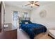 Stylish bedroom with dark blue bedding, dresser and a mirror at 2109 Cape Ivey Ct, Dacula, GA 30019