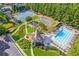 Aerial view of community amenities including a pool, tennis courts, clubhouse and playground at 2109 Cape Ivey Ct, Dacula, GA 30019
