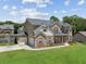 Beautiful two-story home featuring a two-car garage and lush green lawn on a sunny day at 2109 Cape Ivey Ct, Dacula, GA 30019
