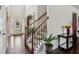 Elegant foyer with hardwood floors, staircase, and arched doorway, creating a grand entrance at 2109 Cape Ivey Ct, Dacula, GA 30019