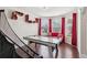 Fun game room with air hockey table, cozy seating, and bright windows for natural light at 2109 Cape Ivey Ct, Dacula, GA 30019