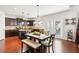 Eat-in kitchen features granite counters, stainless appliances, hardwood floors, and a breakfast area at 2109 Cape Ivey Ct, Dacula, GA 30019