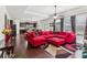 Spacious living room with hardwood floors, a large sectional, and an open view to the kitchen at 2109 Cape Ivey Ct, Dacula, GA 30019