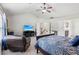 Large bedroom with vaulted ceiling, fan, and adjoining ensuite bathroom and staircase at 2109 Cape Ivey Ct, Dacula, GA 30019