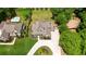 An aerial view shows the backyard with a lush lawn, tall trees, a swimming pool, and a trampoline at 2205 Beaver Shop Ne Rd, Marietta, GA 30066