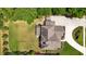 An aerial view of the home with a lush backyard and an expertly landscaped front yard at 2205 Beaver Shop Ne Rd, Marietta, GA 30066