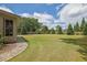 Expansive backyard features a lush lawn, mature trees, and a fence, offering privacy at 2205 Beaver Shop Ne Rd, Marietta, GA 30066