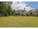 Large backyard with a well-manicured lawn and mature landscaping offering a private outdoor space at 2205 Beaver Shop Ne Rd, Marietta, GA 30066