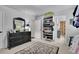 Bedroom featuring a shoe rack, closet, dresser, and a full-length mirror at 2205 Beaver Shop Ne Rd, Marietta, GA 30066