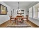 Dining room with hardwood floors, wainscoting and large windows covered with white blinds at 2205 Beaver Shop Ne Rd, Marietta, GA 30066