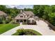 Beautiful home featuring a manicured lawn, complementary shrubbery, and a concrete driveway at 2205 Beaver Shop Ne Rd, Marietta, GA 30066